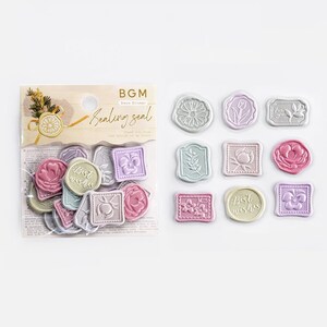 May include: A sheet of decorative sealing stickers with a variety of designs, including flowers, hearts, and the words "Best Wishes". The stickers are in pastel colors and have a raised, embossed texture. The sheet is labeled "BGM Deco Sticker Sealing Seal".
