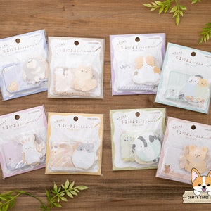 Puede incluir: Un conjunto de ocho blocs de notas coloridos con ilustraciones adorables de animales. Cada bloc tiene un diseño de animal diferente, incluyendo un gato, un perro, un conejo y un pájaro. Los blocs están empaquetados en fundas de plástico transparentes y son perfectos para agregar un toque de fantasía a tu escritorio o planificador.