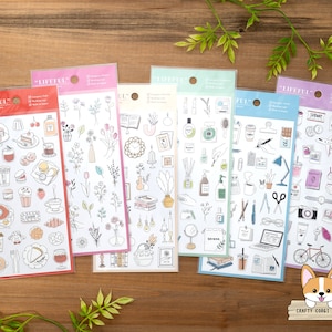 May include: Five sheets of sticker paper with various illustrations. The stickers are black and white line drawings on a white background. The stickers include images of food, flowers, office supplies, and travel. The sticker sheets are labeled "LIFEFUL".