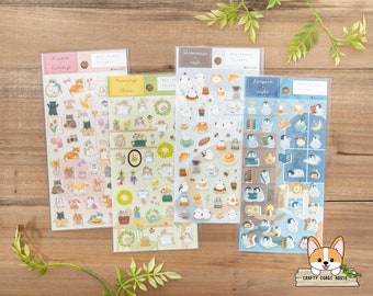 May include: Four sheets of stickers featuring adorable animal illustrations. The stickers are organized by theme: "Kicon Holiday", "Mamanga Flower", "Shimonaya Cafe", and "Penguin Night".