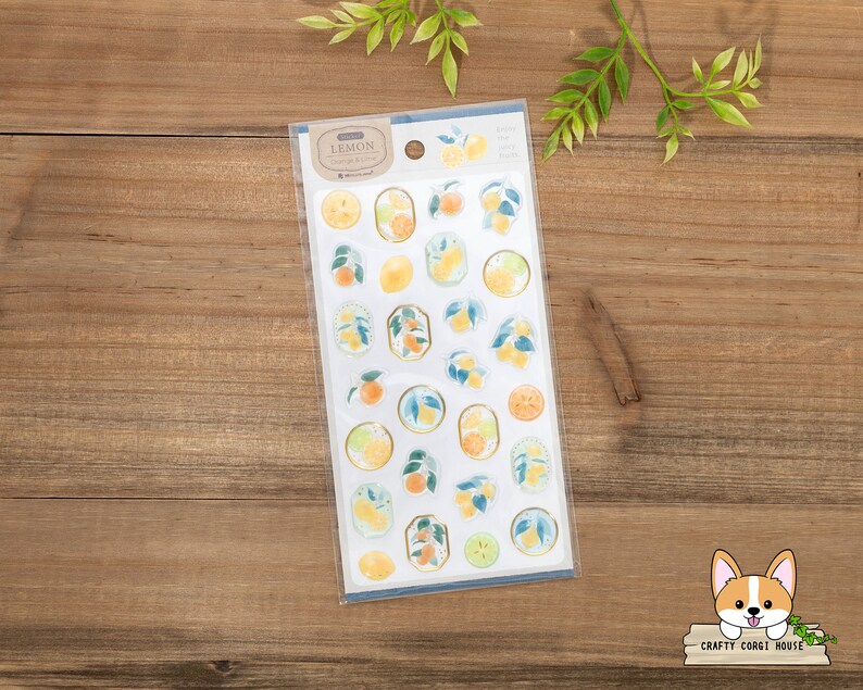 May include: A sheet of lemon-themed stickers with illustrations of lemons, leaves, and branches. The stickers are on a white background with a blue border. The text "LEMON" is printed in the top left corner.