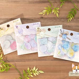 May include: Four packs of sealing wax stickers with different colored wax seals. Each pack has the text "BGM Healing Seal" on the front. The wax seals are in shades of purple, blue, and green.