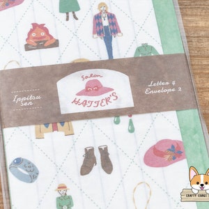 May include: A white and green patterned paper with a brown label that says "Salon Hatter's" and "Ippitsu Sen". The label also says "Letten 4 Envelope 2". The paper has a variety of illustrations including a red and orange fire demon, a woman with blonde hair, a woman with brown hair, a pair of brown boots, a blue ring, a pink hat, and a green hat.