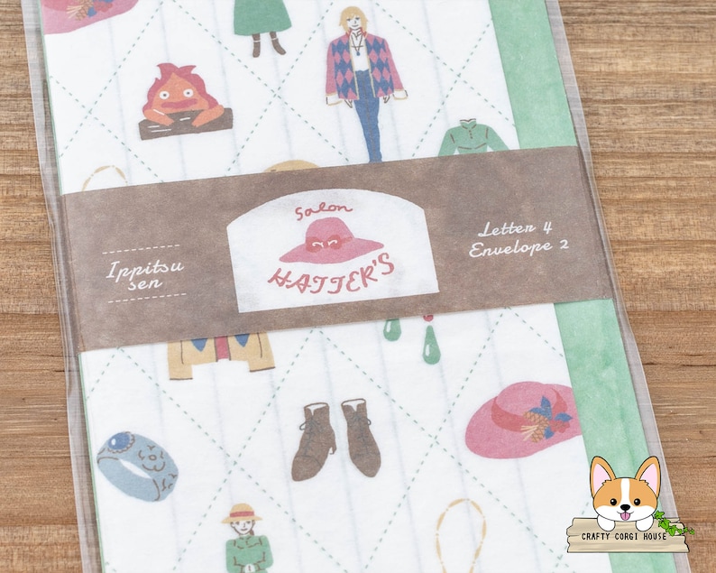 May include: A white and green patterned paper with a brown label that says "Salon Hatter's" and "Ippitsu Sen". The label also says "Letten 4 Envelope 2". The paper has a variety of illustrations including a red and orange fire demon, a woman with blonde hair, a woman with brown hair, a pair of brown boots, a blue ring, a pink hat, and a green hat.