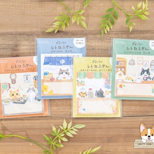 May include: Four packs of colorful cat-themed sticky notes with the text "レトロふせん" (retro sticky notes) and "ねころび" (cuddling) in Japanese. Each pack has 30 notes and features a different cat design.