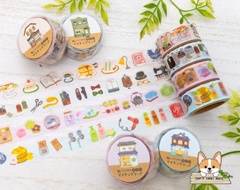 May include: Assortment of colorful washi tapes with various designs, including buildings, birds, flowers, and sewing supplies. The text on the tapes reads "マスキングテープ" which translates to "masking tape" in English.