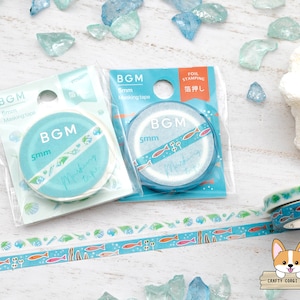 May include: Two rolls of 5mm blue and white masking tape with a sea life design. The tape is packaged in clear plastic with the brand name BGM and the text "Masking Tape" printed on the packaging. The tape is also labeled "Foil Stamping" in Japanese.