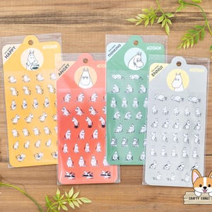 May include: Four sheets of stickers featuring a cartoon character in different poses. The stickers are labeled "Happy", "Angry", "Thinking", and "Ennui".