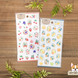 May include: Two sheets of stickers featuring fruit designs. The left sheet has a red and white background with cherries and strawberries. The right sheet has a yellow and white background with lemons. Both sheets have the text "Cherry Berry" and "Lemon" on them.