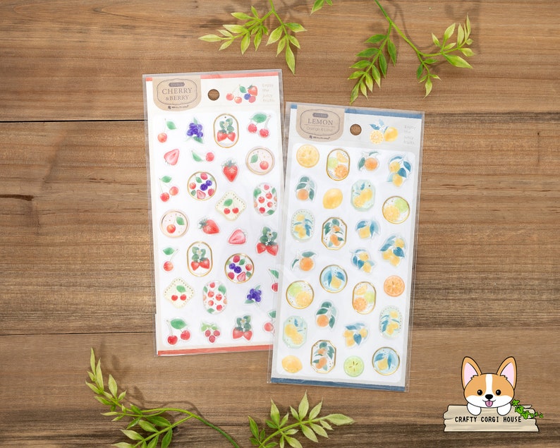 May include: Two sheets of stickers featuring fruit designs. The left sheet has a red and white background with cherries and strawberries. The right sheet has a yellow and white background with lemons. Both sheets have the text "Cherry Berry" and "Lemon" on them.