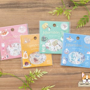 May include: Four sheets of stickers featuring a tea party theme. The stickers are decorated with illustrations of teacups, cakes, and other tea party treats. The stickers are labeled "Afternoon Tea" and have different slogans, including "So Yummy!", "Late Day", "String a Bang!" and "Have a Ren".