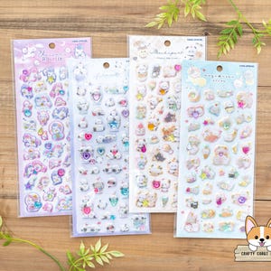 May include: Four sheets of colorful, illustrated stickers featuring cute animal designs. The stickers are packaged in clear plastic sleeves and feature the text "Yumeiro Rosette", "Machigai", "Yumeiro Pastel", and "Yumeiro Pastel".