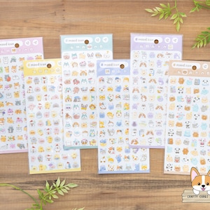 May include: A collection of sticker sheets featuring various cute animal and character designs. Each sheet has a different color header with the text "# mood icon". The stickers are in a variety of colors and shapes, perfect for scrapbooking or decorating.