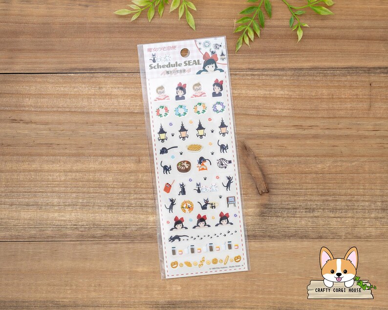 May include: A clear plastic package containing a sheet of schedule stickers. The stickers feature illustrations of cartoon characters, cats, lanterns, and other Halloween-themed designs. The text "SCHEDULE SEAL" is printed at the top.