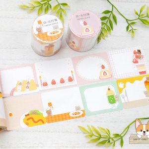 Puede incluir: Un conjunto de rollos de cinta washi decorativos en tonos pastel rosa y amarillo. La cinta presenta ilustraciones de animales de dibujos animados y postres lindos. El texto en la cinta dice "ロール付箋", que se traduce como "nota de rollo".