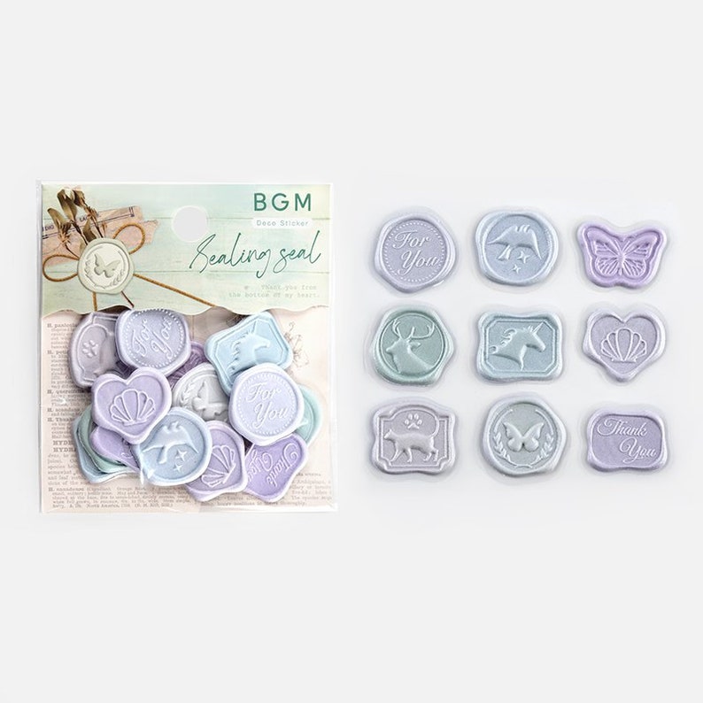 May include: A set of 14 pastel-colored wax seal stickers with various designs, including hearts, stars, animals, and text. The stickers are arranged in a grid on a white background. The text on the stickers includes "For You", "Thank You", and "Love You".