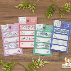 May include: Four packs of colorful sticky notes with floral and geometric patterns. Each pack has 15 sheets of notes and the text "Tyrol Sticky Notes" is printed on each pack.