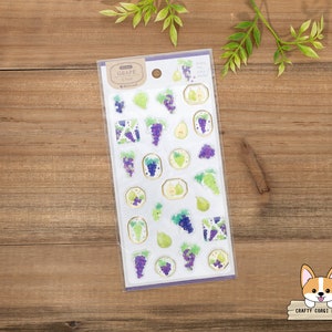 May include: A sheet of clear stickers with illustrations of grapes and pears. The stickers are on a white background with a purple border. The text "GRAPE & PEAR" is printed in black at the top of the sheet.