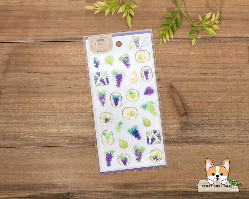 May include: A sheet of clear stickers with illustrations of grapes and pears. The stickers are on a white background with a purple border. The text "GRAPE & PEAR" is printed in black at the top of the sheet.