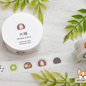 May include: A roll of white washi tape with a variety of colorful Japanese mochi designs. The tape is labeled "Papier Platz" and "W15mmx10m".