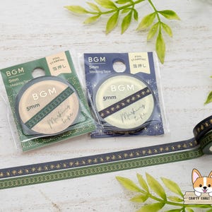 May include: Two rolls of BGM 5mm masking tape in green and navy blue, with gold foil accents. The packaging includes the text "FOIL STAMPING" and "Masking tape". A roll of tape is unraveled, showing the decorative pattern.