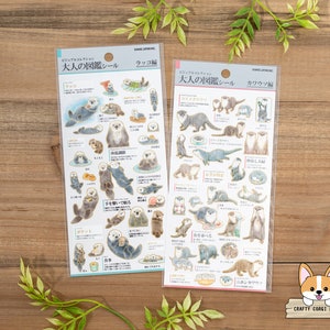 1 vel | Kamio | VISUEEL WOORDENBOEK VOOR VOLWASSENEN goudfolie crêpestickers | Zeeotter - otter (rivierotter)