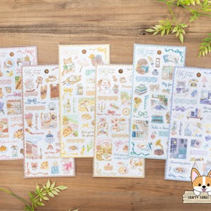 May include: Set of 6 pastel colored sticker sheets with illustrations of animals, flowers, and other cute designs. Each sheet has a different theme, such as "My favorite", "Take a breath", and "Let's go to the picnic".