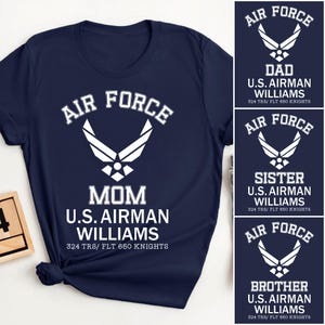 May include: Navy blue t-shirt with the words "Air Force" and an emblem in white. Below the emblem, the text reads "Mom U.S. Airman Williams 324 TRS/ FLT 650 Knights." Additional designs for Dad, Sister, and Brother are also shown.