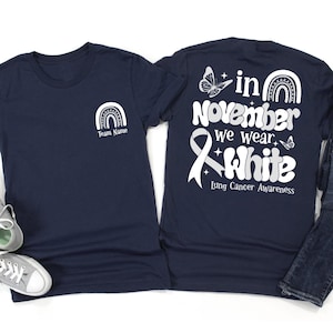 Im November tragen wir ein weißes Hemd, Lungenkrebs-Aufklärungs-T-Stück, weißes Band, Unterstützungsgruppe, Familien-T-Stücke, Kriegergeschenk, benutzerdefinierter Name, Unisex-T-Stück