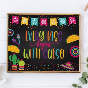 May include: A black chalkboard sign with a gold frame and the text "Every Kiss Begins With Queso". The sign is decorated with colorful Mexican-themed designs, including maracas, cacti, sombreros, and tacos.