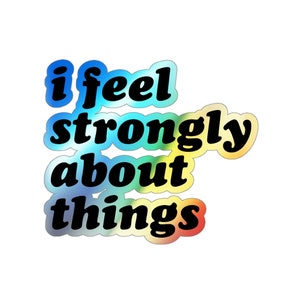 Puede incluir: Una pegatina colorida con el texto "i feel strongly about things" en letras negras y negritas.