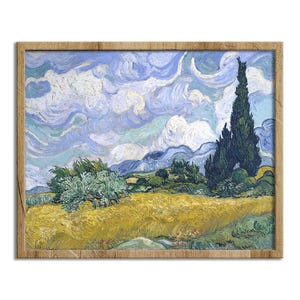 May include: A framed print of a landscape painting featuring a field of yellow wheat, green trees, and a tall, dark green cypress tree under a swirling blue and white sky. The artwork is in a wooden frame.