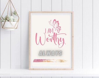 May include: A framed print with a pink butterfly and the text "I AM Worthy ALWAYS" in pink lettering. A gold glitter stripe is at the bottom of the print.