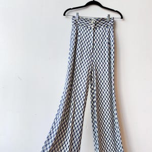 May include: A rustic wooden sign with the text "Welcome to our home" in white lettering. The sign features a distressed finish and a simple, inviting design, perfect for a front porch or entryway.