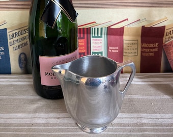 A gorgeous Picquot Ware English  polished solid aluminium 1950's milk jug creamer with handle
