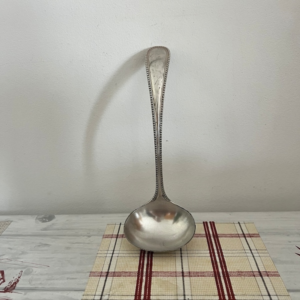 A small  silver Mappin Brothers  19th century ( sun symbol - 1835 ) small  ladle spoon ideal to use to serve sauces, cream, custard