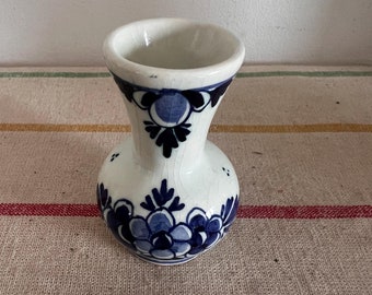 An antique  Delft Blue De Delfts Pauw factory, the Delft Peacock Dutch Holland china hand painted blue and white miniature vase