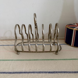 An unusual  English EPNS silver plated six thick  slice toast rack to brighten up your breakfast table