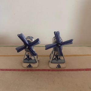 An antique Delft Blue  Dutch Holland china hand painted blue and white salt and pepper set