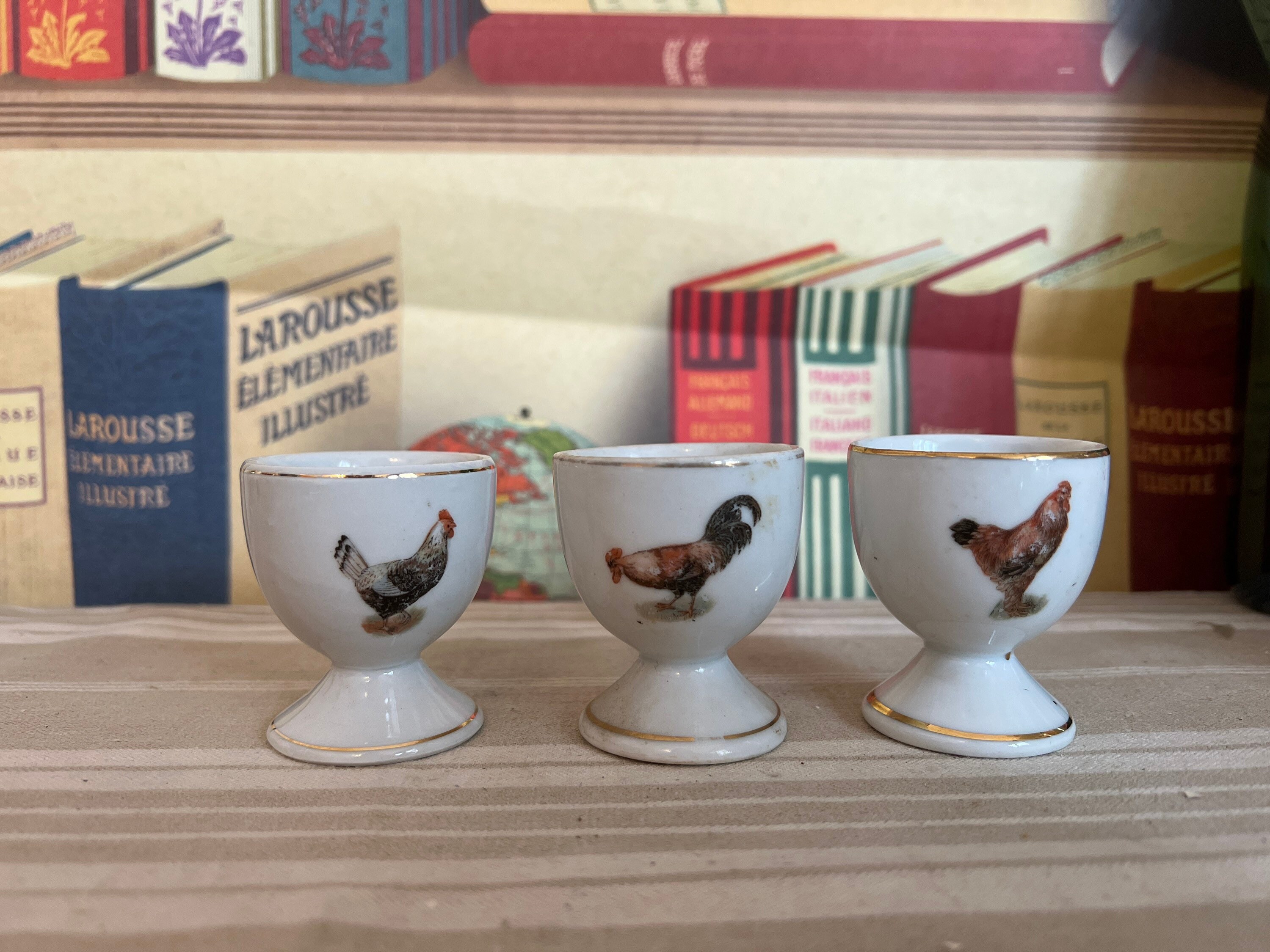 A Collectible Set of Three Foreign Stamped Porcelain Egg