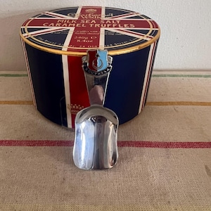 A retro chrome plated Southsea souvenir loose tea caddy spoon or scoop