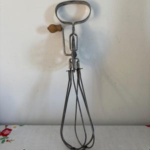 An original rustic Quarter  French hand hand whisk, beater  with a  wooden handle