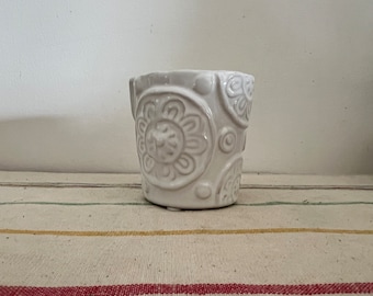 A cute white Paisley floral embossed white china succulent or cactus planter pot