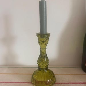 A stunning  vintage green pressed glass candle holder