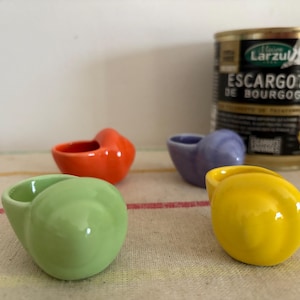 A traditional set of 4 mixed colour French vintage oven proof individual stoneware snail dishes
