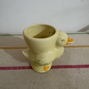 A  cute collectible vintage ceramic duck shaped boiled egg cup
