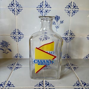 A traditional retro French Pastis Casanis  glass water carafe