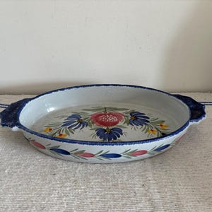 A vintage French Quimper Henriot HB oval   hand painted glazed ceramic cooking pot  dish with floral detail and two integral  handles