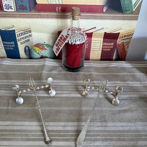 A pair of antique French water lily  heavy weight silver plated  metal  serving cutlery rests, perfect for the buffet table
