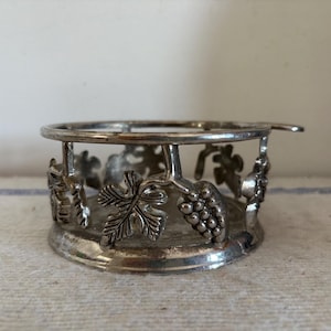 A retro French  silver plated  grape vine design wine or champagne table coaster